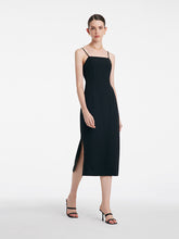 A lady wears a strap dress to go to the casino.